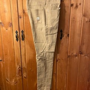 Khaki color stretch fit pants presented by Eddie Bauer